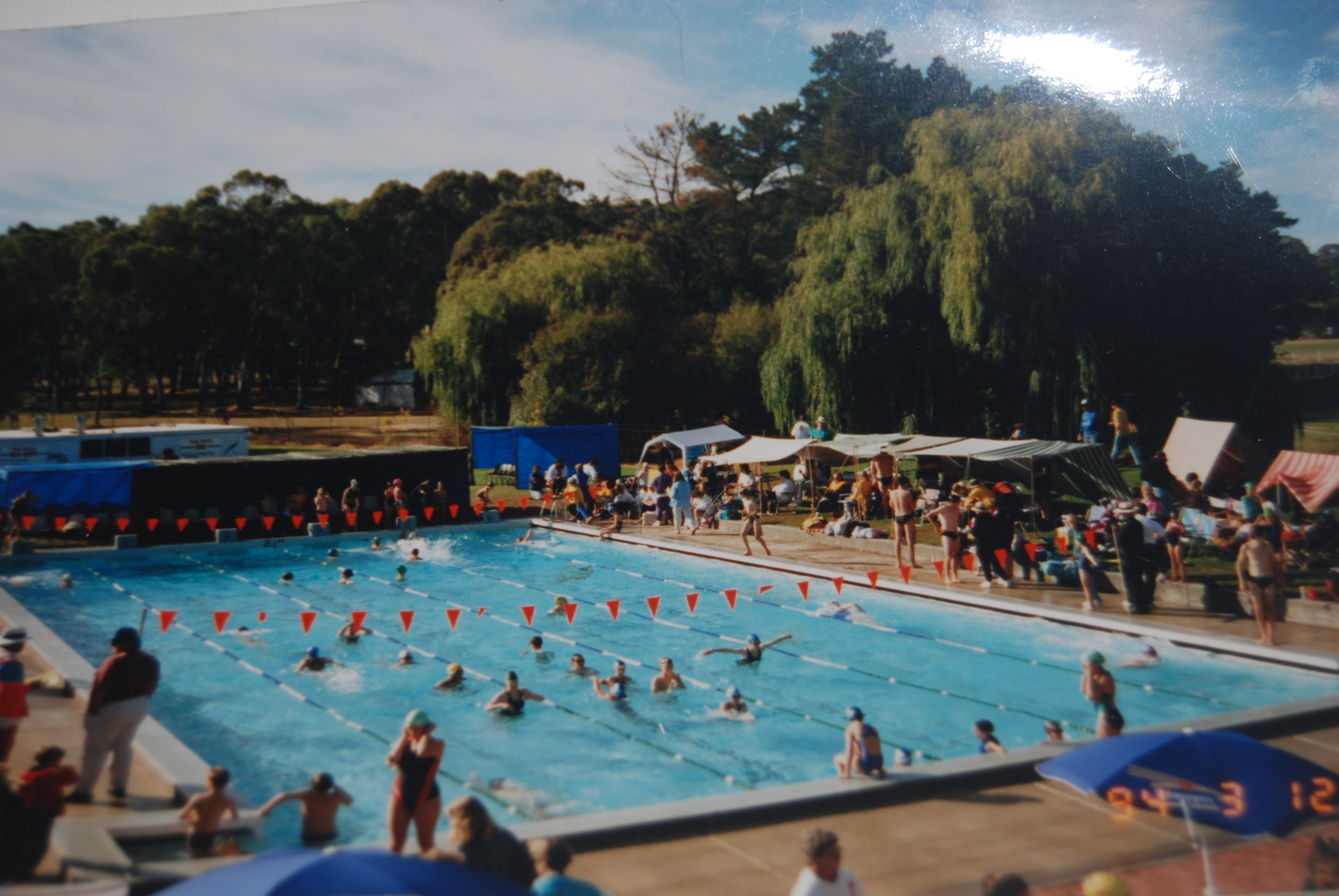 Older Photo of the pool shows it without shades or rear building, that can be seen in more recent photo's.